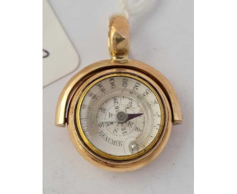 A RARE GOLD SPINNING FOB ONE SIDE IS A COMBINED COMPASS AND THERMOMETER THE REVERSE SIDE SET WITH A BLOOD STONE 10CT GOLD 