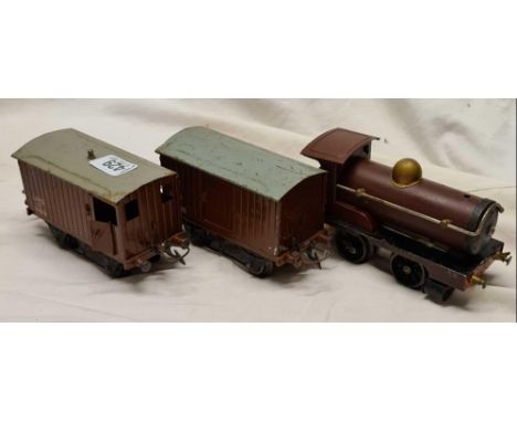 A Hornby Meccano clock work engine 2710 and two LMS goods wagons 