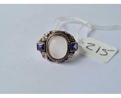 A silver arts and crafts ring set with moonstone and 2 colour change sapphires size M - 6.6 gms 