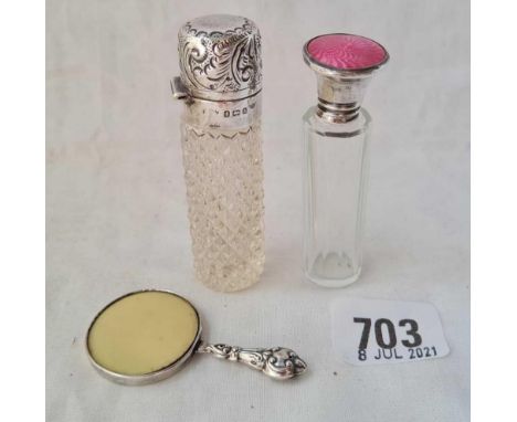 Two scent phials, one with enamel top and a makeup mirror