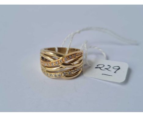 A wide diamond set wavy design ring in 14ct gold size K 7.6g inc