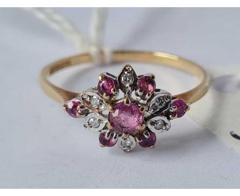 A ruby and diamond cluster ring in 9ct size M