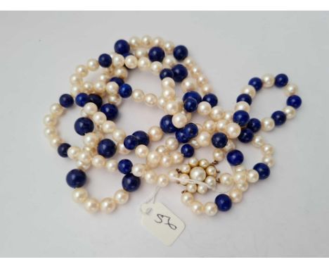 A long pearl and lapis bead necklace 