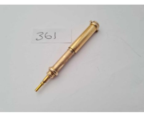A gold cased agate toped propelling pencil - 13gms 