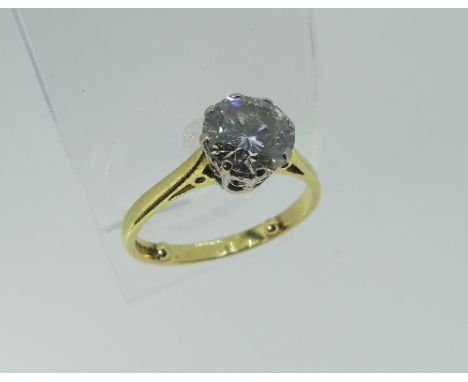 A diamond Solitaire Ring, the stone approx 1¼ct, claw set in 18ct white gold, the shank and shoulders in yellow gold, Size K,