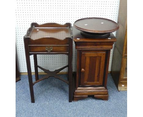 A reproduction mahogany Pot Cupboard, by Willis and Gambier, the planked top upon central drawer above door enclosing shelved