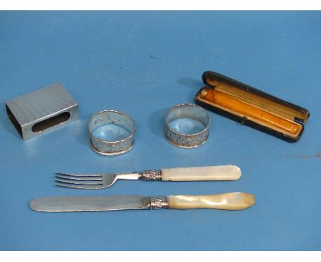 A 9ct gold mounted amber Cheroot Holder, in leather case, together with a silver matchbox holder, two silver napkin rings, di