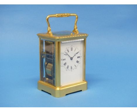 An early 20th century French R.&amp; C. gilt brass striking and repeating Carriage Clock, the corniche case with white enamel