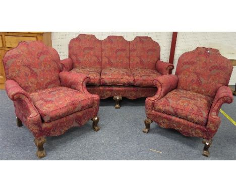 An antique-style Three-piece Suite, the mahogany framed enclosing the sofa and two arm chairs, all fully upholstered in tapes