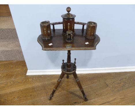 A 19thC mahogany Smoker's Stand/Table, the top fitted with pipe rack, and large central Tobacco jar and three other pots, all