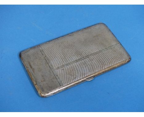 A George V silver Cigarette Case, hallmarked Birmingham, 1929, of rectangular form with engine turned decoration, the gilded 