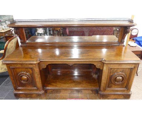 A 19thC Aesthetic Movement burr walnut Sideboard by Lamb of Manchester, the inverted break-front top surmounted by mirror-bac