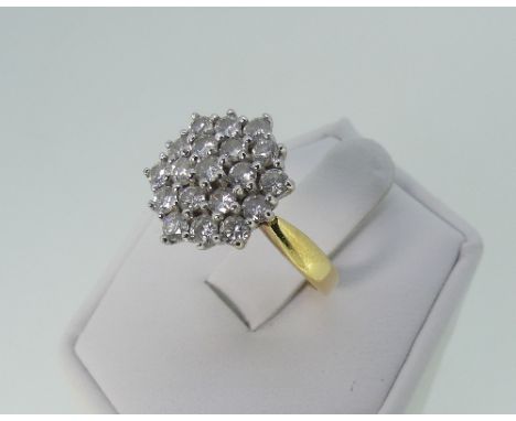 An 18ct yellow gold and diamond Dress Ring, the hexagonal front pave set with nineteen small diamonds, mounted in white gold,