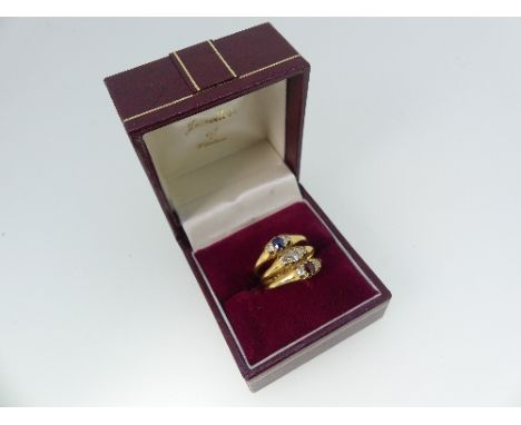 An 18ct yellow gold Dress Ring, formed of three bands joined at the back, set ruby, diamond and sapphire and each with a diam