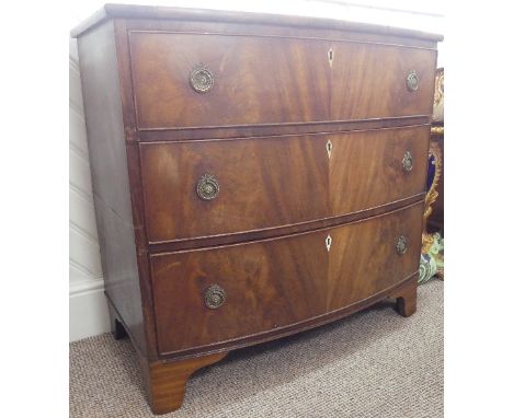 A George III mahogany Bow-front Chest of Drawers, the three long drawers, graduated in size, with kite shape ivory inset keyh