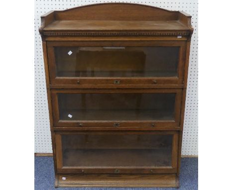 An early 20thC oak 'The Lebus Bookcase', the stacking sectional bookcase in the Globe Wernicke style, with three quarter gall