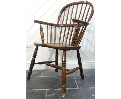 An 18thC ash and elm Windsor-back Chair, the hooped back with stick supports, raised on H-stretcher and turned legs, 22in (54