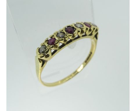 A small ruby and diamond seven stone Ring, mounted in 18ct yellow gold, Size U½, gross total weight 2.6g.