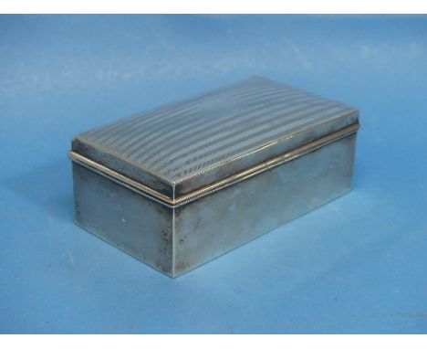 A George VI silver Cigarette Box, by A.&amp; J. Zimmerman Ltd, hallmarked Birmigham, 1945, of wood-lined rectangular form wit