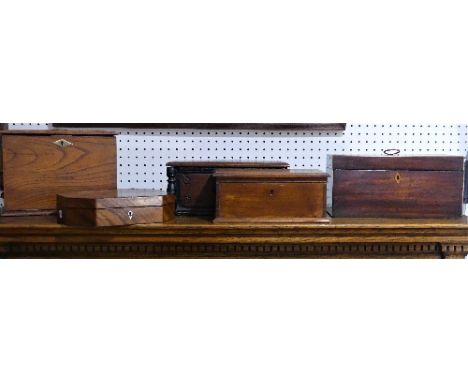 A Georgian mahogany Tea Caddy, the top with brass handle, fitted with glass bowl and hinged tea canisters, 12½in (32cm) wide 