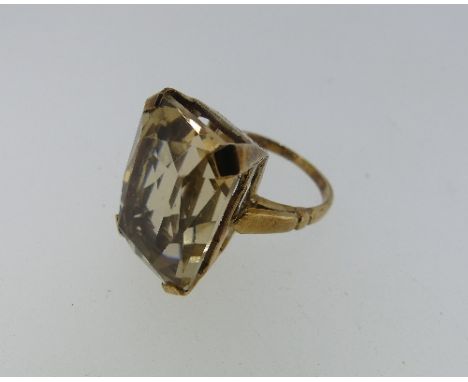 A facetted citrine Ring, mounted in unmarked yellow metal, Size K, the stone 18mm long.