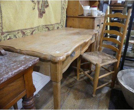 A vintage pine Console Table, the scalloped top upon two frieze drawers, raised on tapering legs and pad feet, 52in (132cm) w