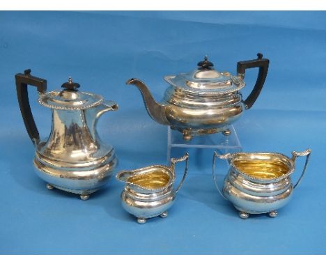 A George V silver four piece Tea Service, by James Deakin &amp; Sons, hallmarked Sheffield, 1918-1921, of waisted ovoid form 