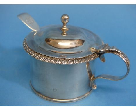 A George IV silver Mustard Pot, hallmarked London, 1826, of drum form with gadrooned rim, the hinged lid with knopped finial,