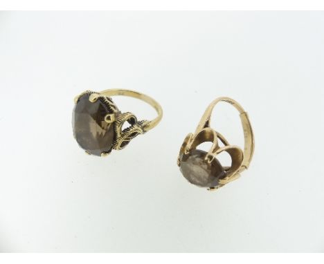 Two smokey quartz Dress Rings, both mounted in 9ct yellow gold, one Size K, the other L with sizer, approx total weight 8.7g 