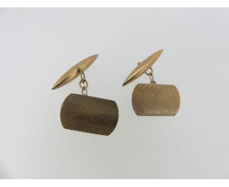 A pair of 9ct rose gold Cufflinks, the shaped rectangular fronts with engine turned decoration, torpedo reverses, chain betwe