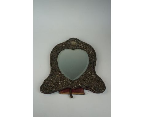 A Edward VII hallmarked silver easel dressing table mirror having cast floral decoration, makers make and distinct London 190