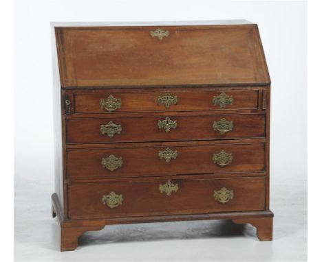 A George III mahogany bureau with a hinged fall front enclosing ten pigeon holes and six short drawers, the lower part with f