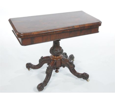 A Victorian Rosewood games tables, the shaped rectangular moulded top with a red beige playing surface, above a plain frieze 