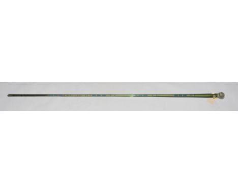 An unusual Victorian green glass walking stick, circular end, spirally turned enclosing multiple coloured roundels, 137cms