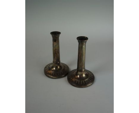 A pair of Victorian hallmarked silver candlesticks of cylindrical form, having chased decoration rim, made by John Green, Rob