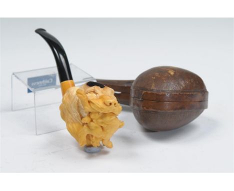 A cased Meerschaum pipe modelled in the form of a hounds head with game contained within a hinged leather case, 19cms