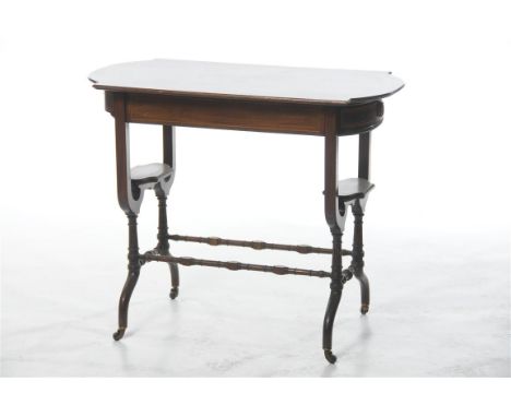 A choice Edwardian inlaid mahogany and satinwood writing table, the shaped rectangular top with bowfront ends, inlaid with a 