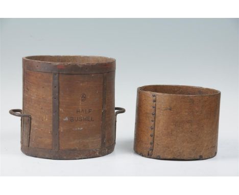 Two Early 20th Century Bushel corn measures, the first metal bound with twin handles stamped with 'G.R' crown stamp and text 