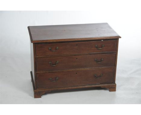 An early 19th century mahogany chest of drawers, the rectangular moulded top above three long graduated cock beaded drawers, 