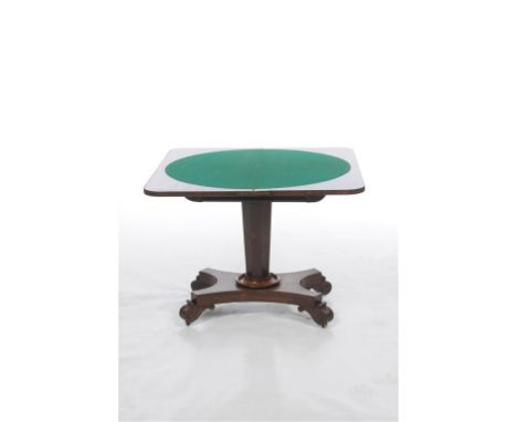 An early 19th century Rosewood games table, the demi lune hinged top with rounded corners, green beige playing surface above 