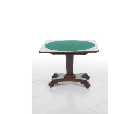 An early 19th century Rosewood games table, the demi lune hinged top with rounded corners, green beige playing surface above 