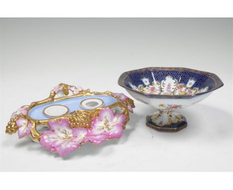 A 19th century continental porcelaneous two division inkwell with a vine and grape border , enclosing a circular pounce pot  