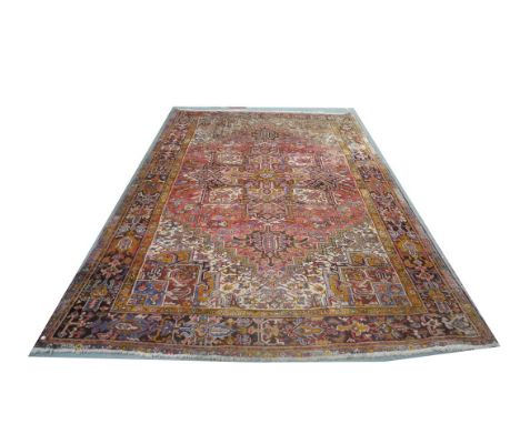 A Persian pattern handmade knotted wool carpet, modern with guard stripes against a faded cream and red ground with outer gua