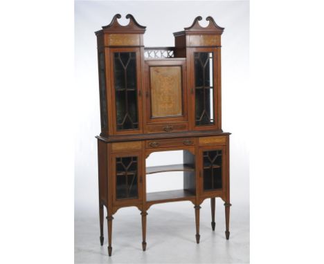 An Edwardian inlaid mahogany cabinet with swan neck cresting's above panels inlaid with drapery and flowers and a cupboard do