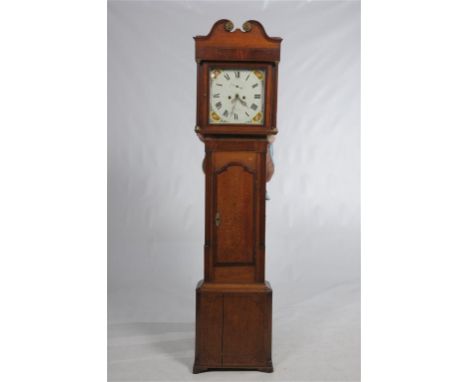 An early 19th century oak and mahogany cross banded long case clock with a 33.5cm white enamel dial indistinctly signed Elles