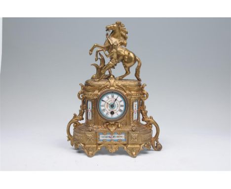 A 19th century French gilt spelter and porcelain mantel clock with a 7.75cm porcelain dial with Roman numerals painted with f
