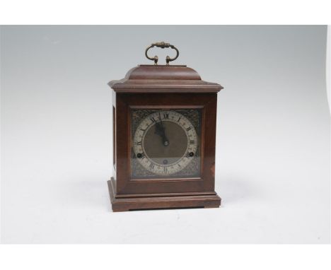 A walnut cased bracket clock, 20th century with a 15cm brass coated dial, silver chaptering, Roman and Arabic numerals, mask 