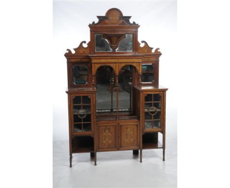 An Edwardian rosewood and ivory inlaid mirror back cabinet, the shaped leaf carved cresting centred with a roundel finely inl