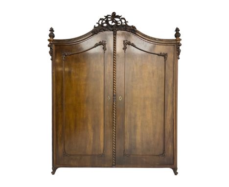 Early 20th century Italian walnut armoire wardrobe, the pierced and scrolling pediment carved with acanthus leaf detail, flan