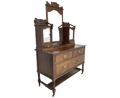 Late Victorian walnut dressing table, raised mirror back with foliate carved pediment and bevelled plate, flanked by raised c